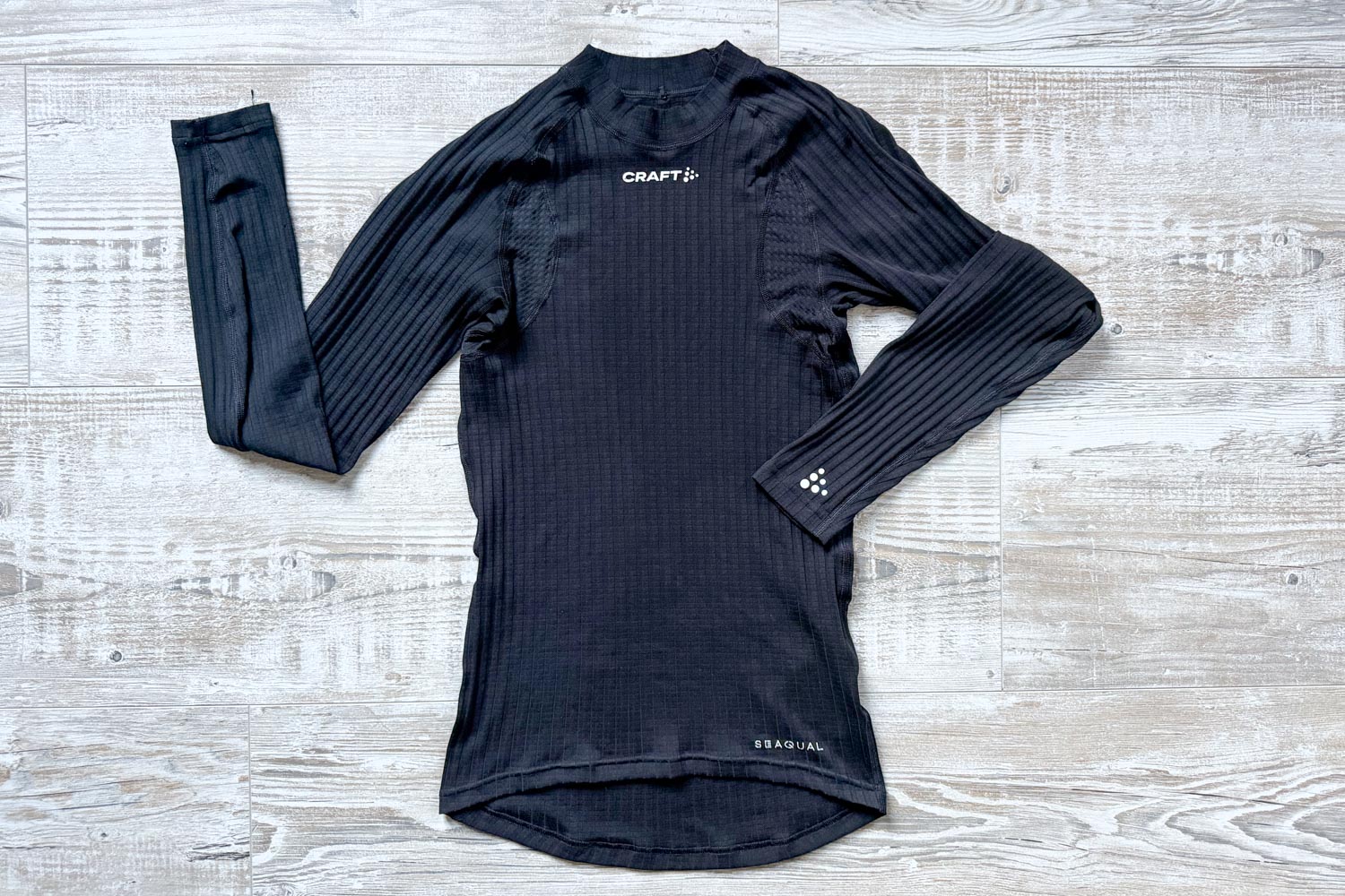 Vue d'ensemble du maillot thermique Craft Active Extreme noir à manches longues à plat.